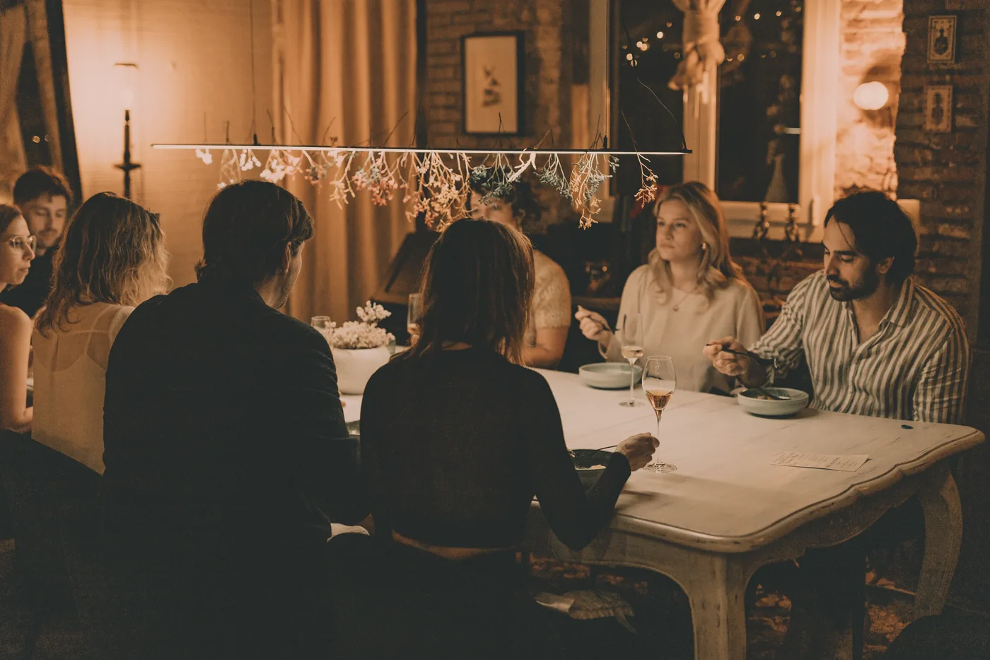Guests seated around the table at The Opera Kitchen